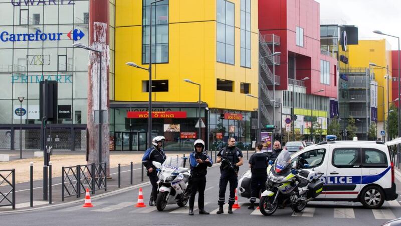 French police outside a shopping centre in the Villeneuve La Garenne area near Paris, France. Some  18 people have been freed after an attempted robbery at a Primark outlet in the centre. Photograph: Etienne laurent/EPA.