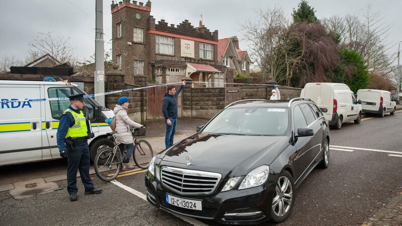 The remains of the deceased are taken from the scene at Castlegreina House on the Boreenamanna Road, Cork. Photograph: Daragh Mc Sweeney/Provision