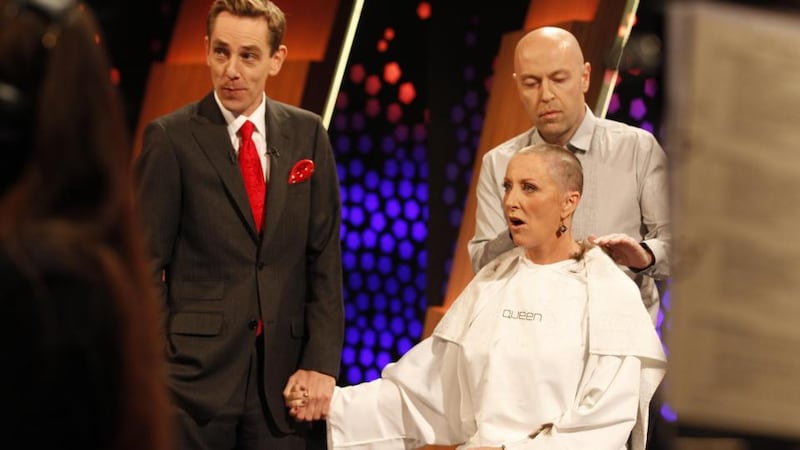 Mrs O’Donnell reacts after having  her hair shaved live on RTE’s Late Late show. Photograph: Andres Poveda/The Irish Cancer Society