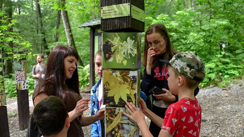 Tourists take a nature walk at the Land of the Leopard national park in July 2020.  Photograph: Yuri Smityukass via Getty Images