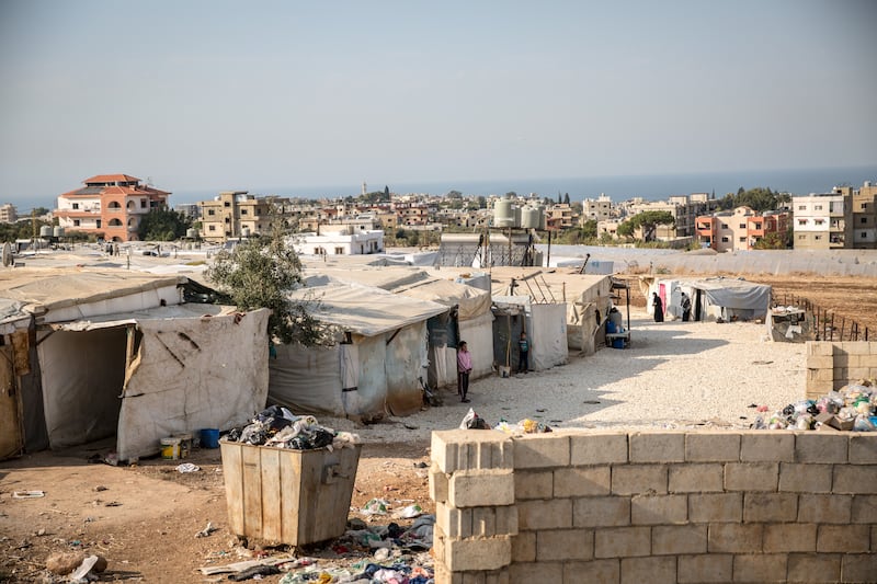 The tent camp where Doha Al-Dayekh, Zuhair Al-Ashqar, and their son Mahmoud live in northern Lebanon. Photograph: Sally Hayden