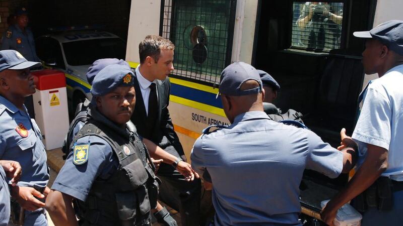 Oscar Pistorius about to enter a police van after his sentencing at the North Gauteng High Court in Pretoria yesterday. Photograph: Siphiwe Sibeko/Reuters