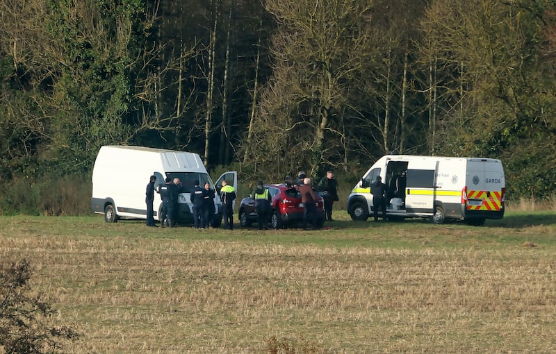 A Garda search team in a field in an area around Grangecon in Co Wicklow on Monday. Photograph: Colin Keegan, Collins Dublin