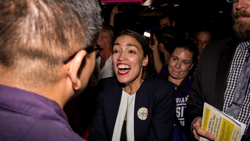 Progressive challenger Alexandria Ocasio-Cortez celebrates with supporters. Photograph: Scott Heins/Getty Images