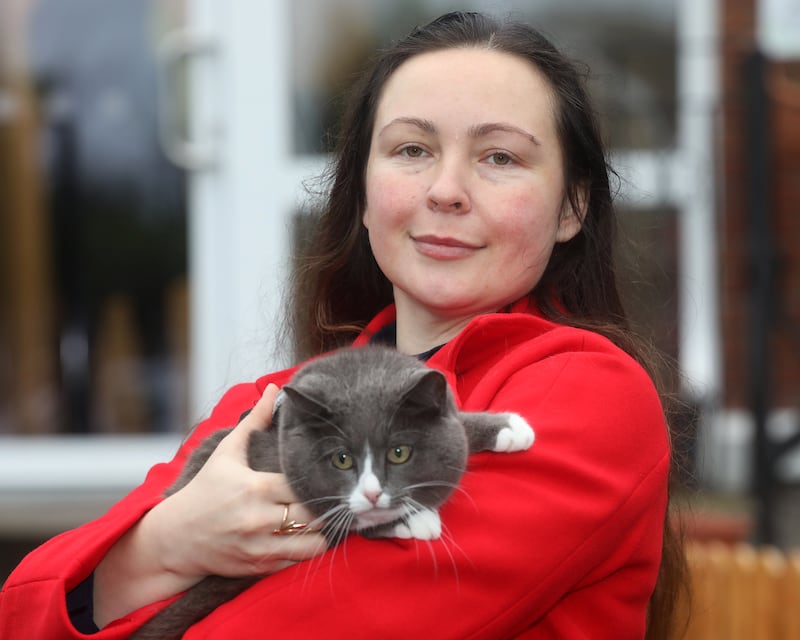 Ukrainian refugee Dariia Revo with her pet cat. Photograph: Brendan Gleeson 