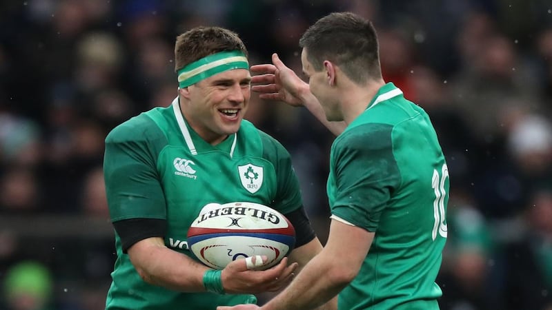 CJ Stander  is congratulated by his Ireland team-mate Johnny Sexton after scoring a try during the  Six Nations match against England  at Twickenham on St Patrick’s Day, 2018. Photograph:  David Rogers/RFU/Getty Images