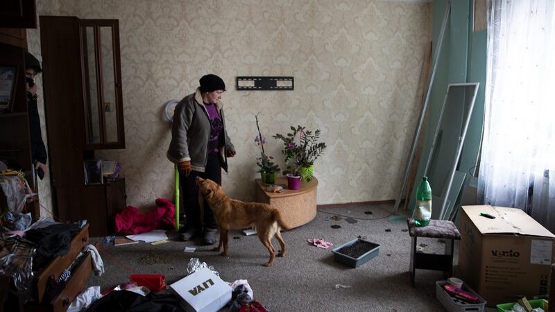 Svitlana Grebinyk at her home in Trostyanets, which was left in disarray after being inhabited by Russian soldiers. Photograph:  Tyler Hicks/New York Times