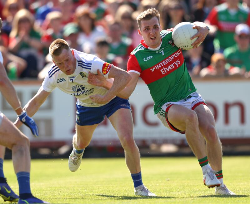 Eoghan McLaughlin drives past Monaghan's Ryan McAnespie in last year's All-Ireland qualifiers. Tom Maher/ Inpho