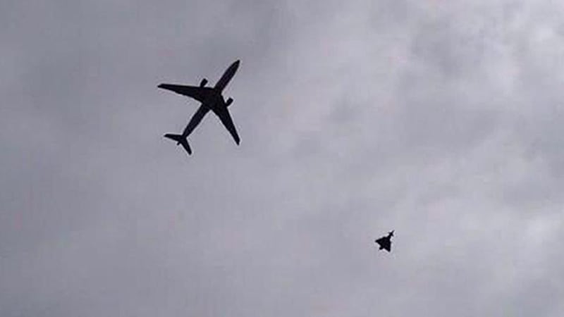 A photo taken from the Twitter feed of @Rob_Whittaker1 with permission from copyright holder @AgnoscoAnimus shows an incoming plane being escorted into Manchester Airport by the RAF “as a result of information received by the pilot about a possible device on board”. Photograph: Benjamin Wilson/PA Wire.