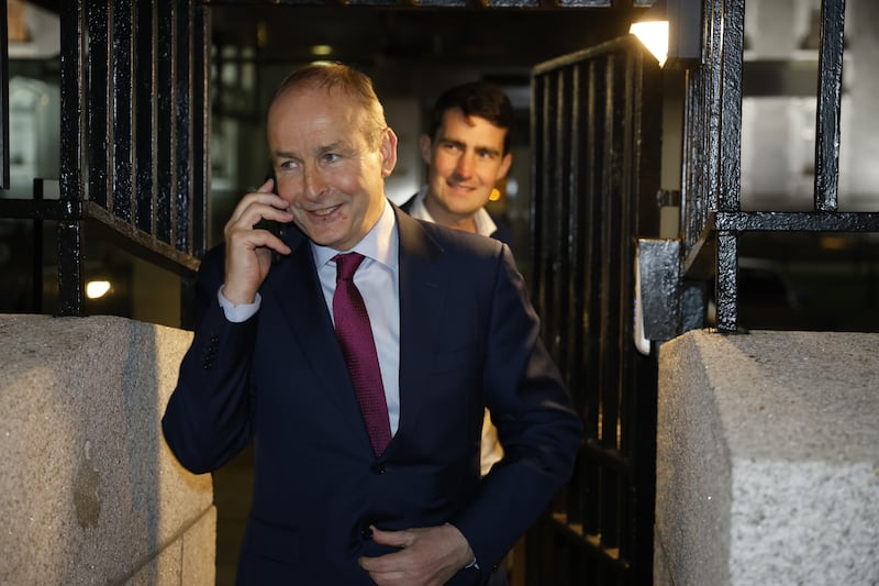 Tanaiste Micheál Martin takes a phone call while leaving Government buildings on January 14th, closely followed by Minister for Finance Jack Chambers. In 2024, Chambers became the youngest finance minister in the history of the State. Photograph: Nick Bradshaw / The Irish Times