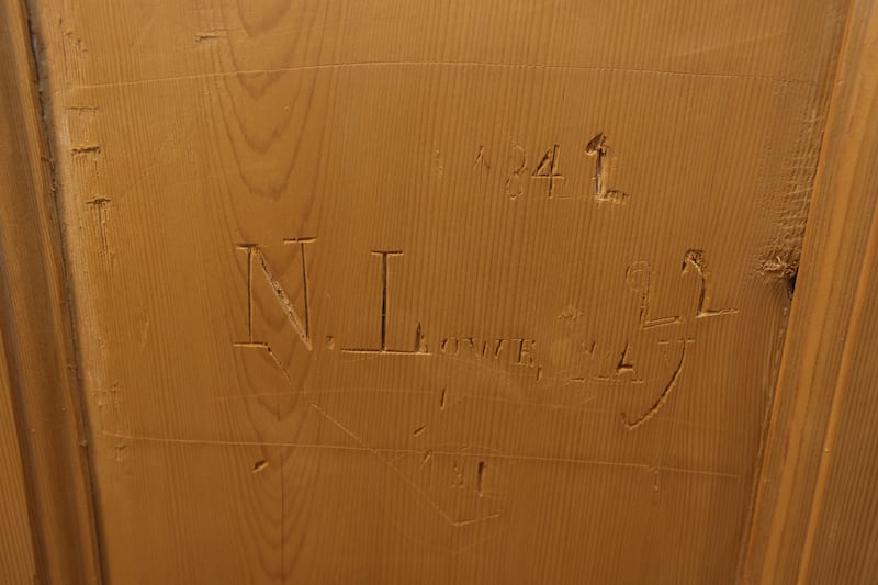 A door into a neighbouring house was discovered in a bedroom during the renovation, while signatures were found on internal doors when their paint was stripped. Photograph: Alan Betson