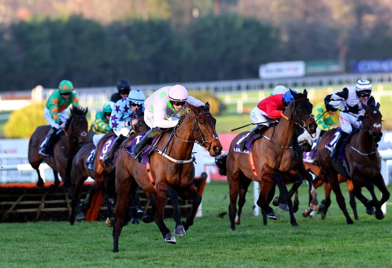 Gaelic Warrior ridden by jockey Paul Townend (pink and green silks) on their way to winning the Festina Lente Charity Liffey Handicap Hurdle. Photograph: Lorraine O'Sullivan/PA