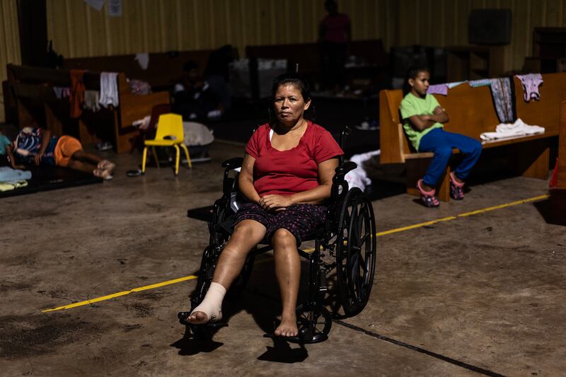 Reyna Gloria Dominguez arrived from Honduras in a wheelchair on Tuesday. Photograph: Go Nakamura/New York Times
                      