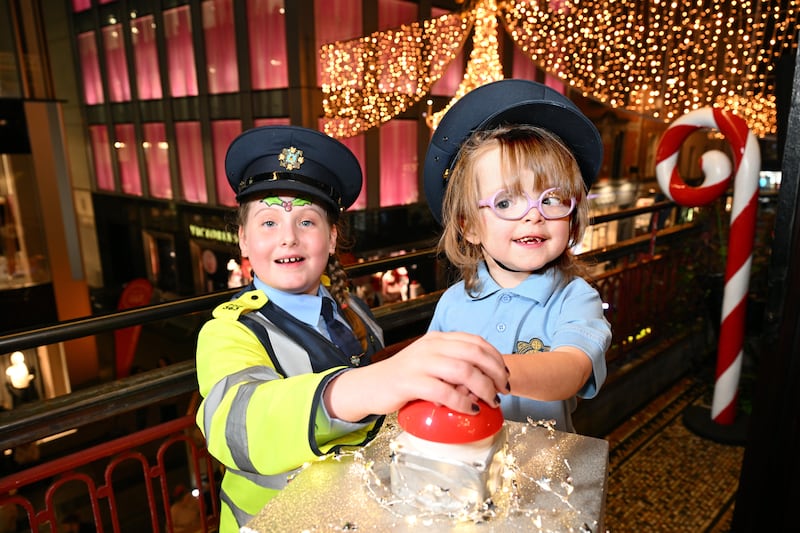 Grafton Street is flooded with festive light as the Christmas illuminations are switched on by Alyssa Reeves (8) and Aine Nolan (4). Photograph: Bryan Meade