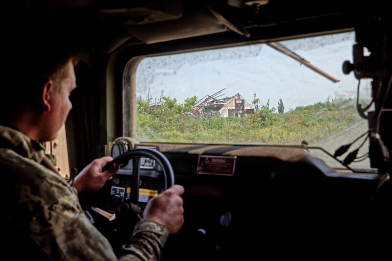 A Ukrainian soldier with the 35th Marine Brigade driving a Humvee outside Makarivka. Photograph: Tyler Hicks/New York Times