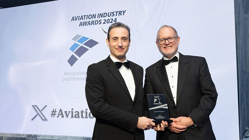 Kyriakos Kourousis, awards judge, presents the best of technology award to David Miller, Inflight Dublin