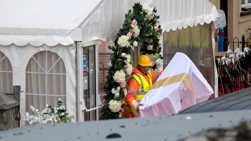 A table is removed as gardaí and contractors remove the wedding marquee at Burton Park, Leopardstown this afternoon which has been ordered to be taken down by a court. Photograph:  Colin Keegan, Collins Dublin