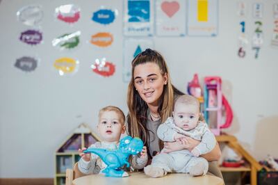 Courtney Cronin with her sons, Dawson (2) and William (four months), at The Southside child and family centre. Photgraph. Brian Arthur