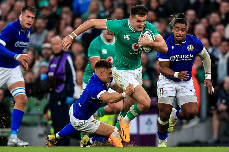 Ireland's Jacob Stockdale is tackled by Italy's Stephen Varney. Photograph: Evan Treacy/Inpho