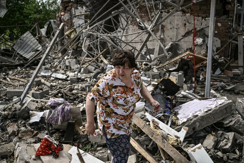 A woman looks for belongings in the rubble of their house on June 1st after a strike destroyed three houses in the city of Slovyansk in the eastern Ukrainian region of Donbas. Photograph: Aris Messinis/AFP via Getty Images