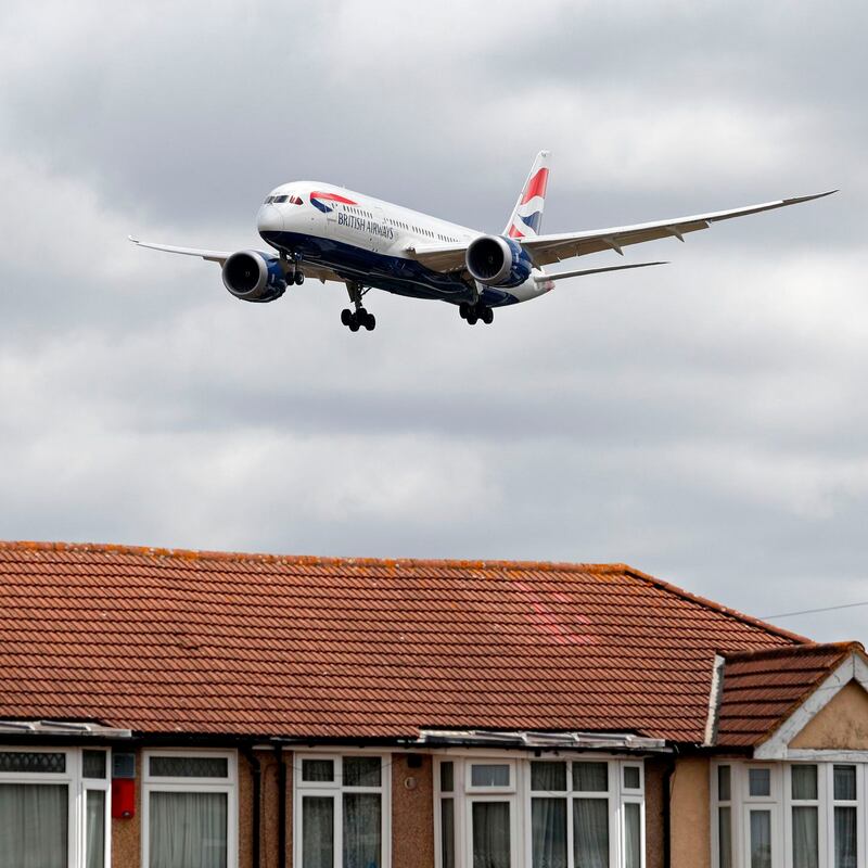 A British Airways Boeing 787 comes in over houses to land at Heathrow airport. Photograph: Adrian Dennis/AFP via Getty