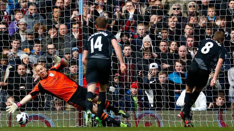 Liverpool's Steven Gerrard (R) scores a penalty past Aston Villa's Brad Guzan at Villa Park. Photograph: Darren Staples/Reuters