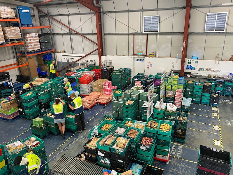 Food bank volunteers and staff do what they can to help out. Photograph: The Felix Project/PA