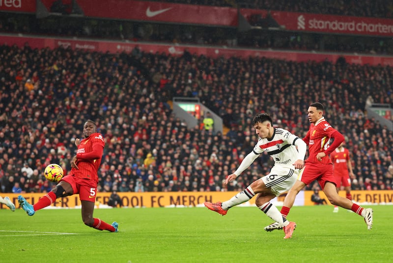 Lisandro Martinez scores the opening goal for Manchester United at Anfield. Photograph: Carl Recine/Getty Images