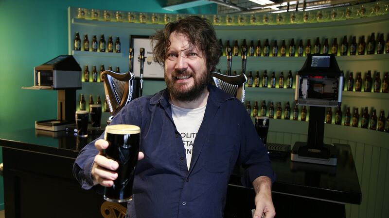 Patrick tries his hand at pouring his own pint of stout. Photograph: Nick Bradshaw/The Irish Times