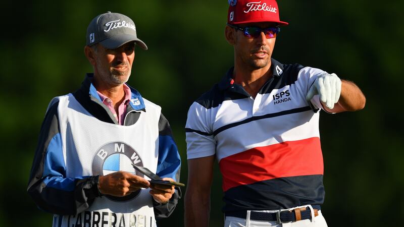 Spain’s Rafa Cabrera-Bello discusses a shot with caddie Colin Byrne during the BMW International Open at Golfclub Munchen Eichenried in June. Photograph: Stuart Franklin/Getty Images