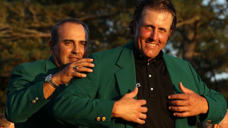 Angel Carbrera presents Phil Mickelson with his green jacket  after his win in 2010. Photograph: Streeter Lecka/Getty Images for Golf Week