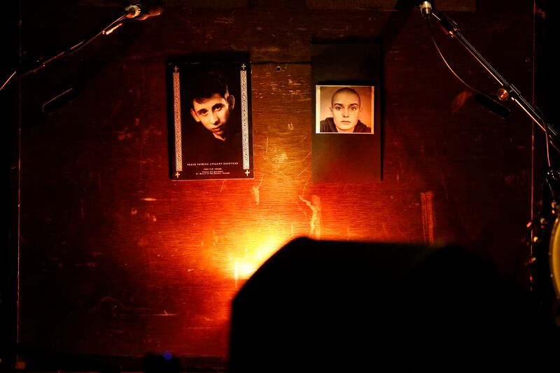 Photographs on stage of Shane MacGowan and Sinead O'Connor at the Gate Theatre, Dublin