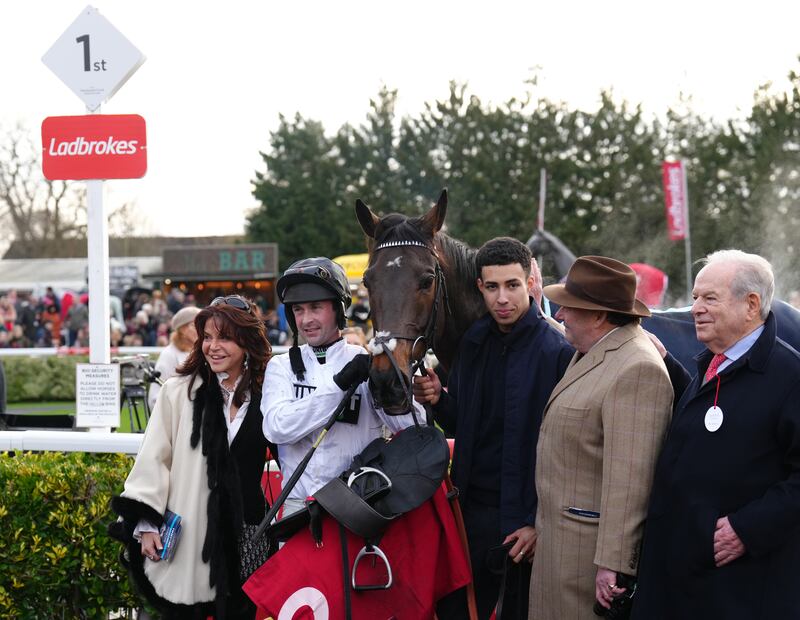 Jockey Nico de Boinville celebrates winning The Ladbrokes Christmas Hurdle on Constitution Hill with Trainer Nicky Henderson and owner Michael Buckley (right). Photograph: John Walton/PA Wire