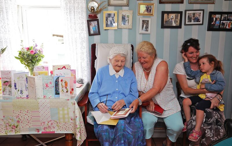 Bridget Tierney on her 103rd birthday with her daughter Mary, granddaughter Victoria and great-granddaughter Lara. Photograph: Lorraine Teevan