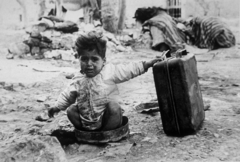 A Palestinian child sits in a refugee camp following the Nakba. Photograph: Keystone Features/Getty Images