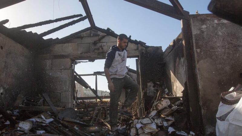 An Israeli man inspects his burned house after a major fire swept the coastal city of Haifa, northern Israel,  November 25th, 2016. Photograph: Atef Safadi/EPA