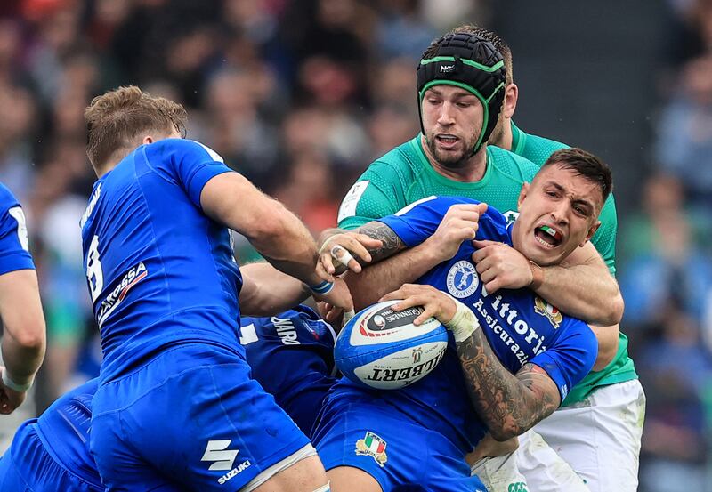 Ireland’s Caelan Doris tackles Pierre Bruno of Italy at the Stadio Olimpico in Rome. Photograph: Dan Sheridan/Inpho 