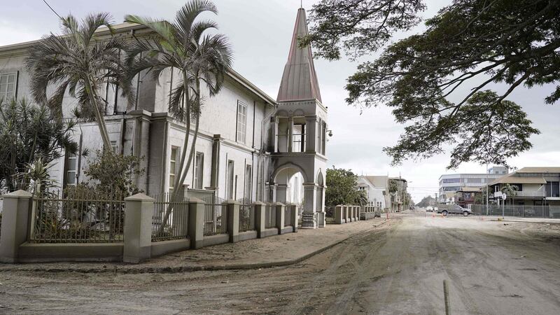 Volcanic ash covers the street by the former prime minister’s office in Tonga’s capital Nukualofa. Photograph: Mary Lyn Fonua/Matangi Tonga/AFP via Getty Images