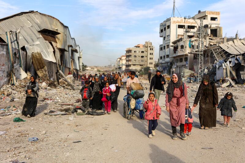 Displaced Palestinians, fleeing Beit Lahia in the northern Gaza Strip, walk on the main Salah al-Din road on November 17th. Photograph: Omar Al-Qattaa/AFP via Getty