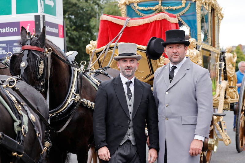 Brothers Brendan and David Mulreany, who supply the Dutch Friesian horses that draw the Lord Mayor's carriage, on the first day of the RDS Dublin Horse Show 2023. Photograph: Alan Betson
