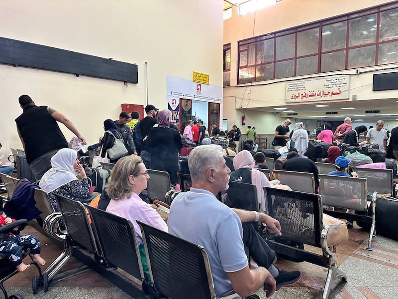 Some foreign passport holders wait at Rafah border crossing after evacuations on Wednesday. Photograph: EPA