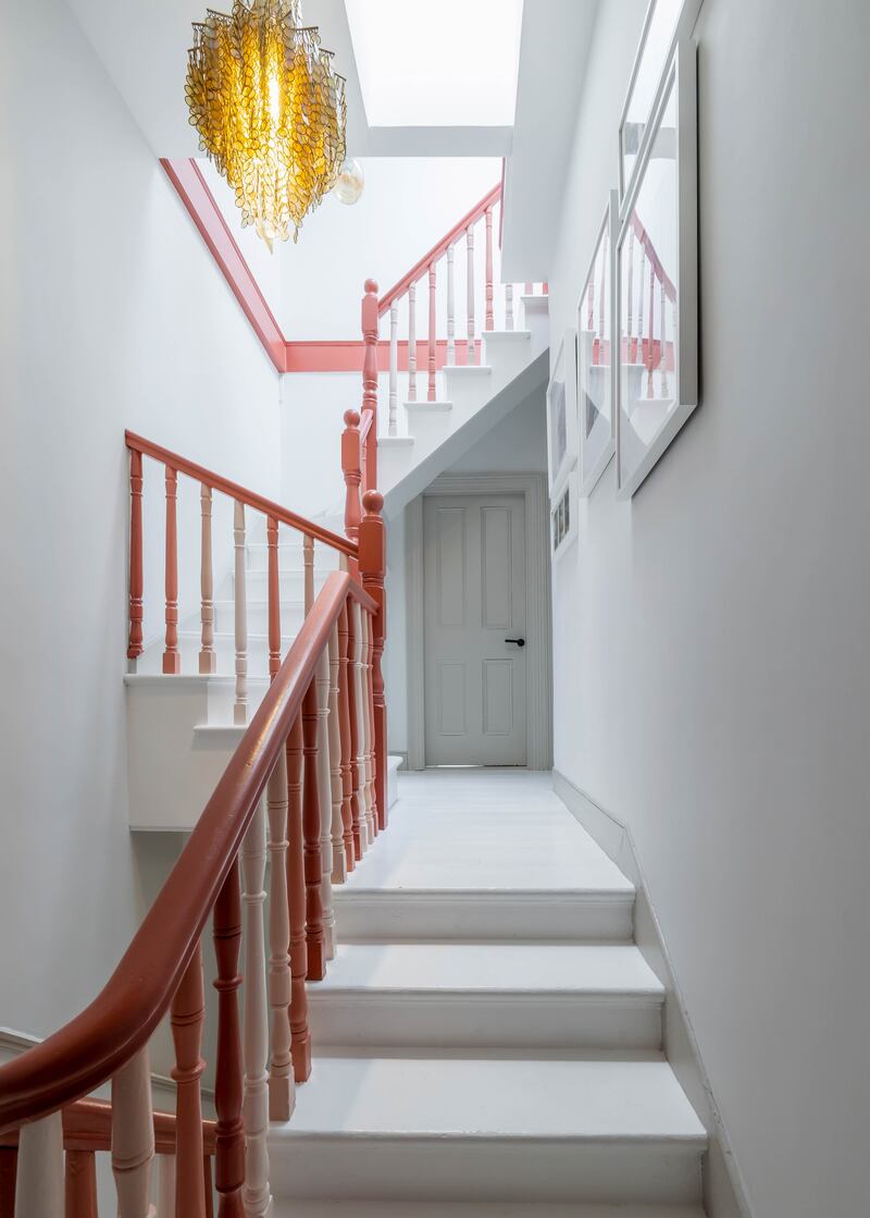 In the hall and landing, the rail is painted in Poppy Rose while successive balustrades wear four different Colourtrend colours: Poppy Rose, Marble Pink, Angel Breath and Chinese Cherry, repeated all the way up the house. The steps and treads wear hard-wearing floor paint from Nordic firm Tikkurila