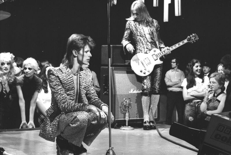 Ziggy Stardust: David Bowie and Mick Ronson on the BBC music show Top of the Pops in January 1973; Suzi Ronson is in the audience on the right, in a white T-shirt. Photograph: Watal Asanuma/Shinko Music/Getty