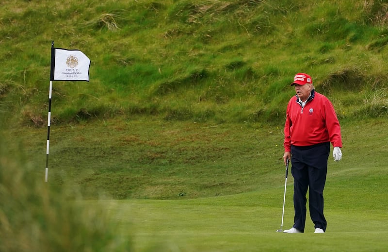 Donald Trump playing golf at Trump International Golf Links & Hotel in Doonbeg, Co Clare, during his visit to Ireland in 2023. Photograph: Brian Lawless/PA Wire