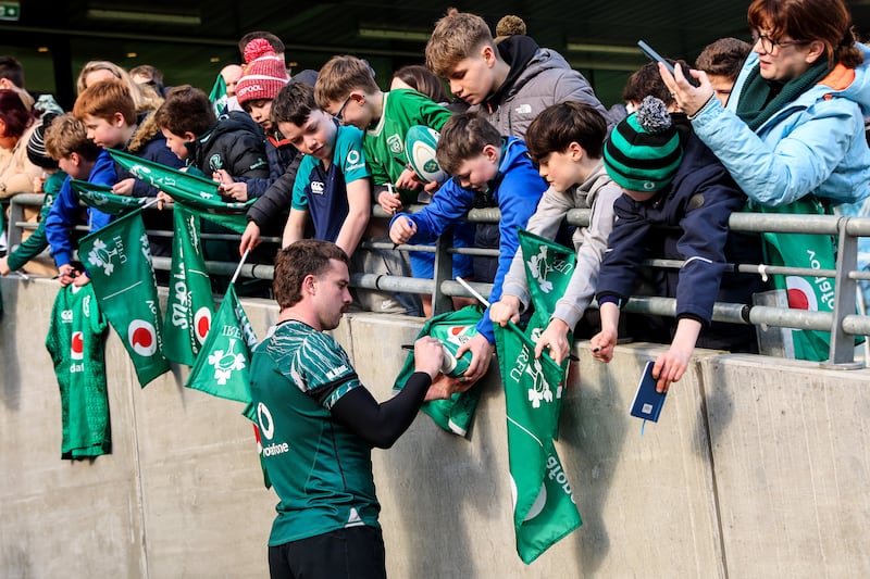 Mack Hansen signs autographs for fans at the Aviva Stadium. Photograph: Ben Brady/Inpho 