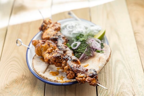 Barbecued chicken shawarma with flatbread and tzatziki