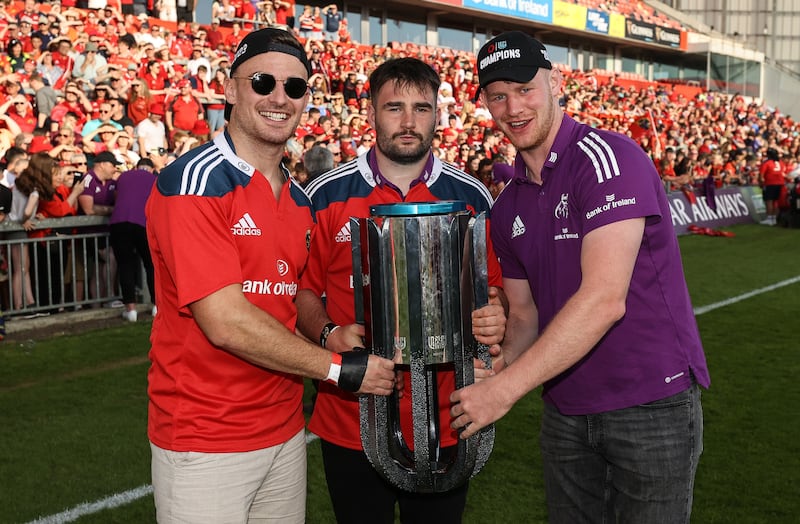 Munster’s Shane Daly, John Hodnett and Cian Hurley celebrate with the URC trophy. Photograph: Ben Brady/Inpho