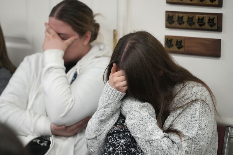  Two  woman hold back tears at a news conference at city hall on the murder of eight people in the same family in January   in Enoch, Utah. Photograph: George Frey/Getty Images