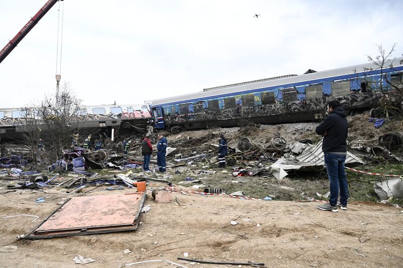 Wrecked carriages lay strewn across the site of the incident. Photograph: Sakis Mitorlidis/AFP via Getty