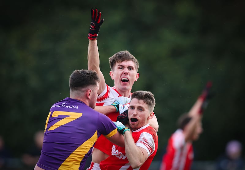 Tempers flare between Kilmacud Crokes' Tom Fox and Michael Fitzsimons and Luke Keating of Cuala. Photograph: Tom Maher/Inpho